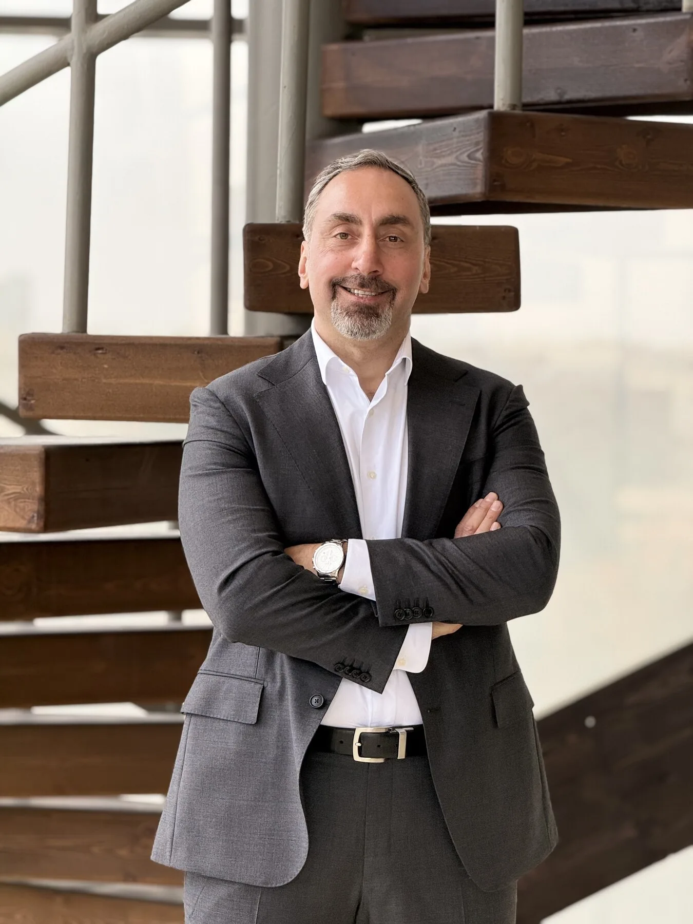 Zahi Abdein standing confidently in a professional interior